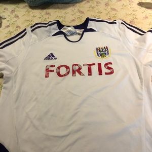 Gently used men’s soccer jersey by Adidas!
